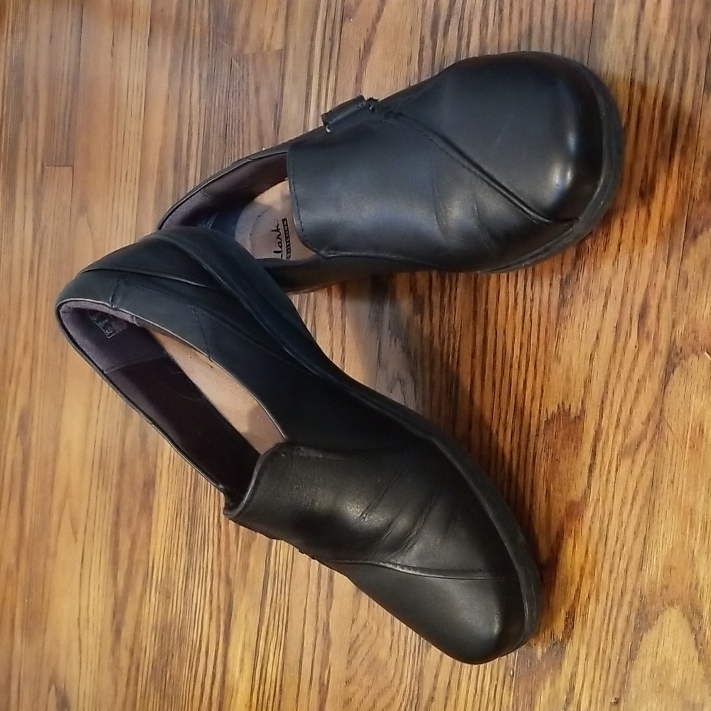 Clark's "Cushion Soft" slip-on shoes.